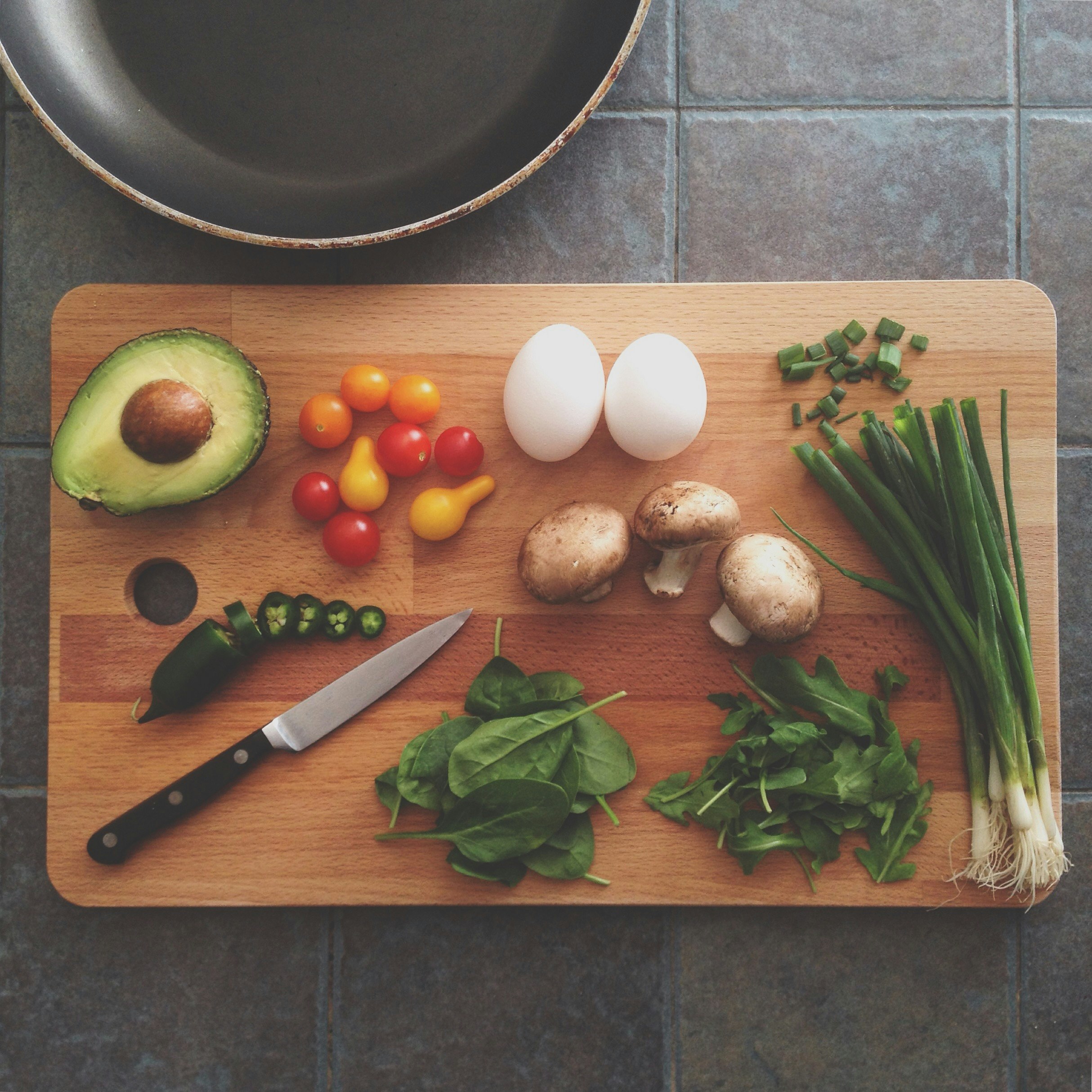 Chef cooking with fresh local vegetables